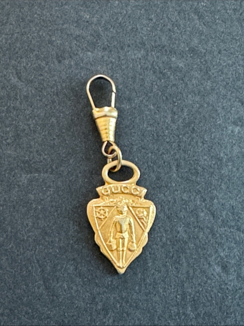 Vintage Gucci gold-plated knight crest shield charm/pendant from the 1960